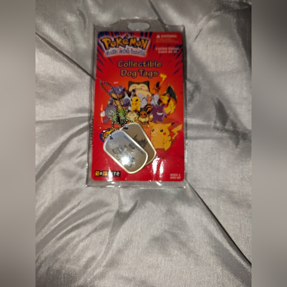 NIB- vintage, pokémon dog tags, number 55, Golduck